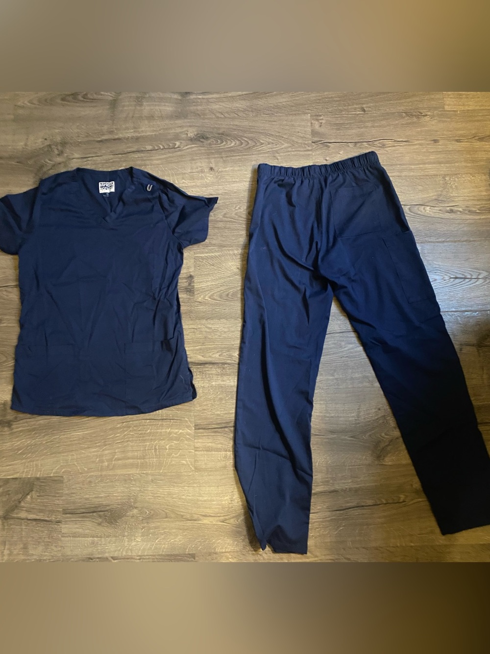 Women’s navy scrub pants and top